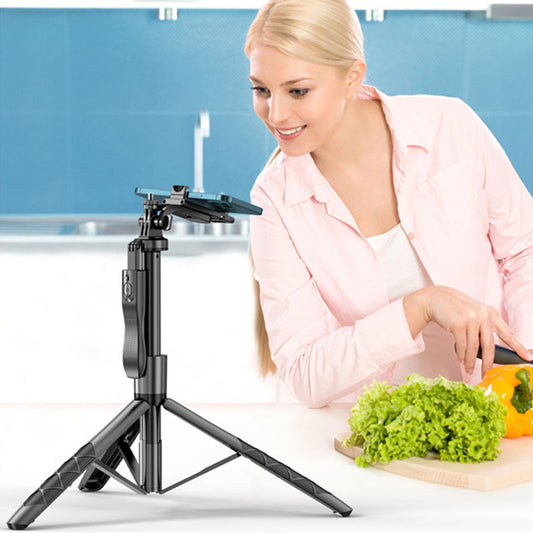 Mobile Phone Holder Gimbal Stabilizer Tripod with a woman using it in a kitchen setting while chopping vegetables.